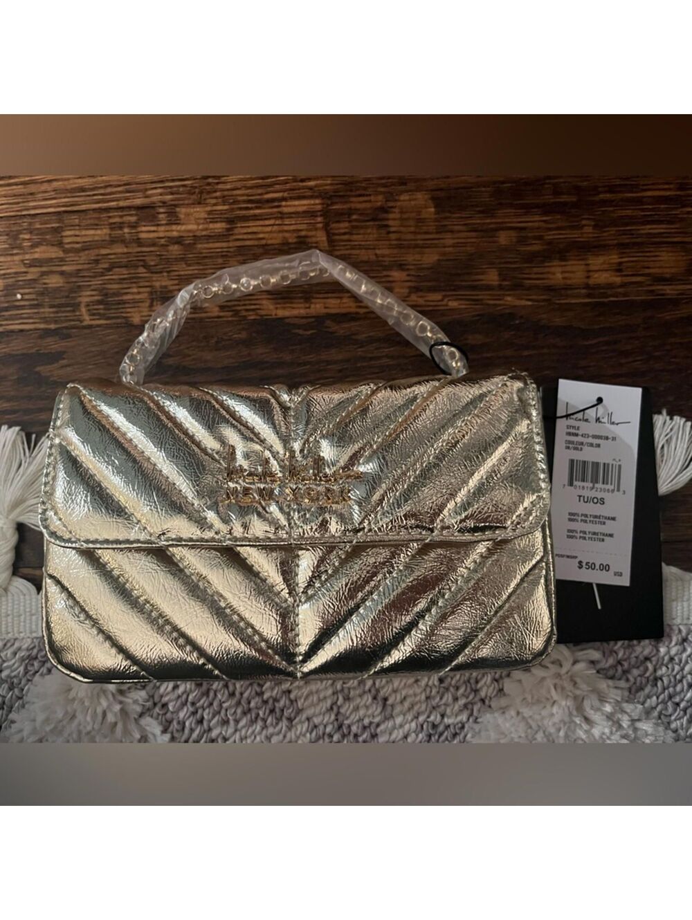 NWT Nicole Miller Gold cross body purse.